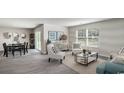Open-concept living and dining area with contemporary decor and plenty of natural light at 182 Cambridge Dr., Tabor City, NC 28463