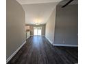 Open-concept living space with sleek hardwood floors and bright, neutral paint at Tbd20 Privetts Rd., Conway, SC 29526