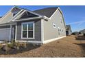 Gray siding house with white trim and gutters at 2104 Ballast Ct., Myrtle Beach, SC 29579