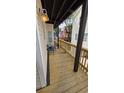 View of the outdoor deck with neutral siding on the house and comfortable seating at 6001 South Kings Hwy., Myrtle Beach, SC 29575