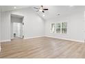 Large main bedroom with hardwood floors, vaulted ceilings, and access to the bathroom at 4414 Kinlaw St., Little River, SC 29566