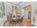 Elegant dining room featuring a round table, hardwood floors, and stylish decor at 5303 Pheasant Dr., North Myrtle Beach, SC 29582