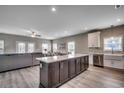 Open-concept kitchen and living area with stainless steel appliances and modern finishes at 113A 12Th Ave. S, Surfside Beach, SC 29575