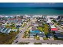 Aerial view of coastal neighborhood with colorful houses, lush greenery, and convenient beach access at 526 Dogwood Dr. N, Garden City Beach, SC 29576