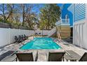 Inviting backyard pool area with stylish lounge chairs and well-maintained landscaping at 514 Vista Dr., Murrells Inlet, SC 29576