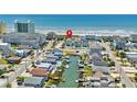 Aerial view showing home's location near the beach and waterway at 5207 Ocean Blvd. N, North Myrtle Beach, SC 29582