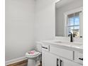 Modern bathroom with white vanity and black fixtures at 1509 Crooked Hook Rd., North Myrtle Beach, SC 29582