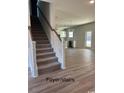 Foyer with stairs leading upstairs and a view into the living area at 1327 Winding Creek Way, Myrtle Beach, SC 29588