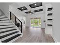 Modern staircase with black metal railing leading to the upper level at 2844 Mcleod Ln., Myrtle Beach, SC 29588