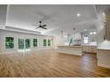 Bright open living space with a view of the kitchen island and a sliding glass door at 205 Brush Ct., Little River, SC 29566