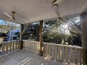 Spacious deck with wooden railings and scenic wooded views at 189 Brown Pelican Loop, Pawleys Island, SC 29585