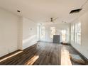 Bright living room with white walls and wood flooring at 189 Brown Pelican Loop, Pawleys Island, SC 29585