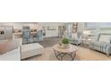 Open-concept living area with a view of the modern kitchen and cozy dining space at 90 Arbor Crest Ln., Tabor City, NC 28463
