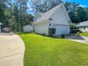 This beautiful home boasts a two-car garage, shed, and plenty of yard space at 412 Callie Dr., Myrtle Beach, SC 29588