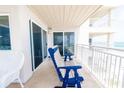 Condo balcony with chairs looking over beach; doors lead into the living room at 5800 N Ocean Blvd. # 705, North Myrtle Beach, SC 29582