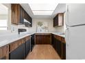 Galley kitchen with wood cabinets and appliances at 6625 Scotsman Crescent, Myrtle Beach, SC 29588