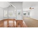 Inviting living room with vaulted ceilings, large windows, and beautiful flooring, perfect for entertaining at 910 Emanon St., North Myrtle Beach, SC 29582