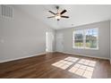 Bright living room featuring hardwood floors and a ceiling fan at 355 Barn Owl Way, Conway, SC 29527