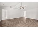 Spacious living room featuring hardwood floors and high ceilings at 623 Snowy Owl Way, Conway, SC 29527