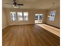 Bright and spacious living area with hardwood floors and access to a patio at 573 Beckham Ct., Murrells Inlet, SC 29576