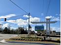 Entrance to Meadows Edge community with landscaped flowerbed in corner near the community sign at 1068 Oak Meadow Dr., Conway, SC 29526