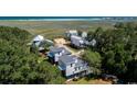 Aerial view featuring property's proximity to marsh and beach at 216 Brown Pelican Loop, Pawleys Island, SC 29585