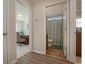 Hallway with views of a home office and bathroom, showcasing the home's layout at 615 Snowy Owl Way, Conway, SC 29527