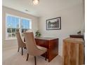 Bright home office with a large window, featuring a wooden desk and comfortable seating at 615 Snowy Owl Way, Conway, SC 29527