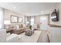 Inviting living room showcasing a comfortable sofa, stylish decor, and a view of the home's entrance at 8928 Brynlee Rd. # 4B, Longs, SC 29568
