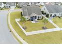 Beautiful backyard with palm trees, white picket fence, and screened in porch at 1266 Brighton Hill Ave., Myrtle Beach, SC 29588