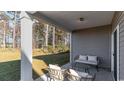 Relaxing covered patio with seating area at 149 Pampa Dr., Loris, SC 29569