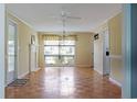 Inviting living room featuring hardwood floors, a decorative fireplace, and a bright window at 530 Swallow Ave. # 530, Myrtle Beach, SC 29577