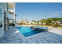 Luxury pool with spa and water feature, surrounded by stone at 129 Serenity Point Dr., Little River, SC 29566