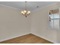 Empty dining room with chandelier, hardwood floors, and neutral walls at 622 Castle Ct., Myrtle Beach, SC 29579