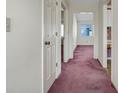 Bright hallway with doorways leading to other rooms with pink carpeting at 213 Birkdale Ln., Myrtle Beach, SC 29588