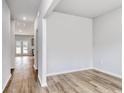 Bright, open-concept living space with wood-look floors and neutral paint at 126 Hancher Dr., Myrtle Beach, SC 29588