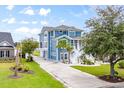 Stunning two-story home with a long driveway, beautiful lawn, and meticulously maintained landscaping at 1533 Biltmore Dr., Myrtle Beach, SC 29579