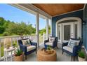 Charming porch with cozy chairs and nautical-themed decor, creating a welcoming outdoor space at 1533 Biltmore Dr., Myrtle Beach, SC 29579