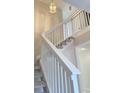 Bright, carpeted staircase with white railings leading to the upper level at 1861 Crooked Pine Dr. # A5, Surfside Beach, SC 29575