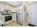 Small kitchen with stainless steel appliances at 500 River Oaks Dr. # 58I, Myrtle Beach, SC 29579