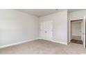 Comfortable bedroom with neutral carpet, closet, and access to the bathroom at 368 Clear Lake Dr., Conway, SC 29526