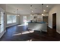 Bright, open kitchen featuring white cabinets, an island, and stainless steel appliances at 1033 Sioux Swamp Dr., Conway, SC 29527