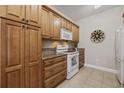 Well-equipped kitchen with granite countertops and ample wood cabinets at 160 Lazy Willow Ln. # 204, Myrtle Beach, SC 29588