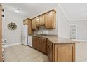 Modern kitchen featuring granite countertops and wood cabinetry at 160 Lazy Willow Ln. # 204, Myrtle Beach, SC 29588