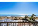 Balcony view of ocean and sandy beach at 4719 S Ocean Blvd. # 209, North Myrtle Beach, SC 29582