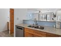 Double stainless steel sink with gooseneck faucet in a small kitchen at 209 75Th Ave. N # 10, Myrtle Beach, SC 29572