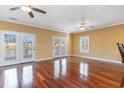 Bright living room with hardwood floors and access to a deck overlooking the water at 1335 Hidden Harbor Rd., Myrtle Beach, SC 29577