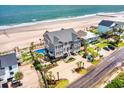 Beautiful beach house with pool and ocean views, nestled near pristine sands at 1907 S Waccamaw Dr., Garden City Beach, SC 29576