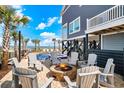 Inviting outdoor fire pit area perfect for entertaining and enjoying ocean breezes at 1907 S Waccamaw Dr., Garden City Beach, SC 29576