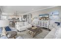 Open-concept living space with stylish furnishings and abundant natural light at 1907 S Waccamaw Dr., Garden City Beach, SC 29576